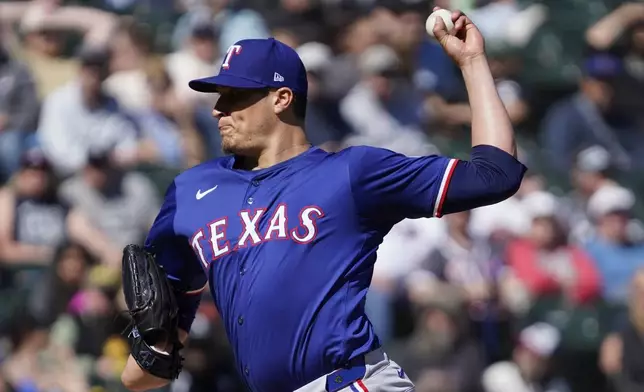 Texas Rangers pitcher Robert Garcia throws against the Chicago White Sox during the ninth inning of a baseball game Sunday, May 25, 2025, in Chicago. (AP Photo/David Banks)