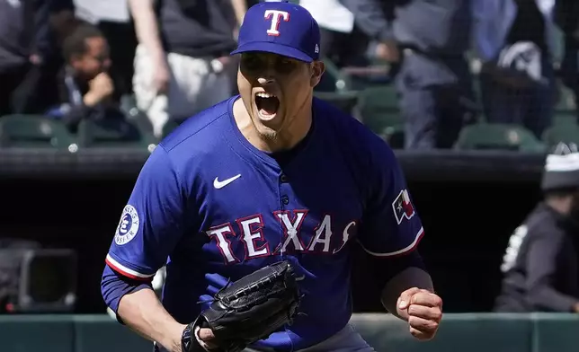 Texas Rangers pitcher Robert Garcia (62) celebrates after getting the final out against the Chicago White Sox during the ninth inning of a baseball game Sunday, May 25, 2025, in Chicago. (AP Photo/David Banks)
