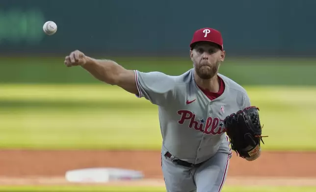 Philadelphia Phillies starting pitcher Zack Wheeler pitches in the first inning of a baseball game against the Cleveland Guardians in Cleveland, Sunday, May 11, 2025. (AP Photo/Sue Ogrocki)
