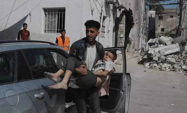 A Palestinian boy, injured following an Israeli airstrike, is brought for treatment to the Baptist Hospital in Gaza City, Friday, May 30, 2025. (AP Photo/Jehad Alshrafi)