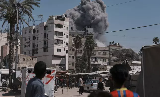 Smoke rises in the sky following an Israeli airstrike in Gaza City, Friday, May 30, 2025. (AP Photo/Jehad Alshrafi)