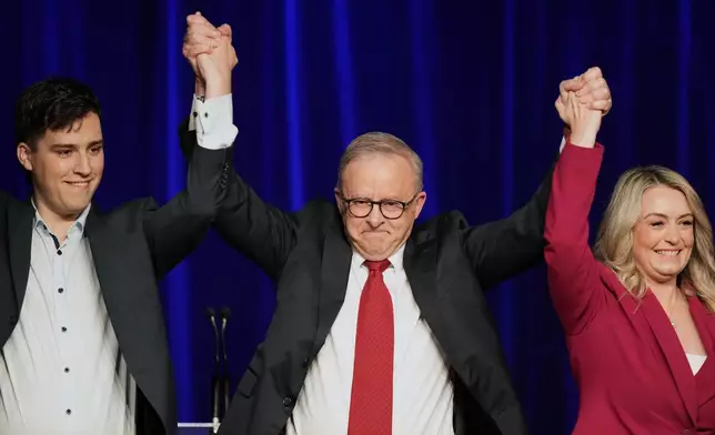 Australian Prime Minister Anthony Albanese, his partner Jodie Haydon and son Nathan react as they meet the party faithful after winning a second term following the general election in Sydney, Saturday, May 3, 2025. (AP Photo/Rick Rycroft)