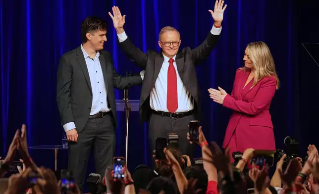 Australian Prime Minister Anthony Albanese, his partner Jodie Haydon and son Nathan react as they meet the party faithful after winning a second term following the general election in Sydney, Saturday, May 3, 2025. (AP Photo/Rick Rycroft)