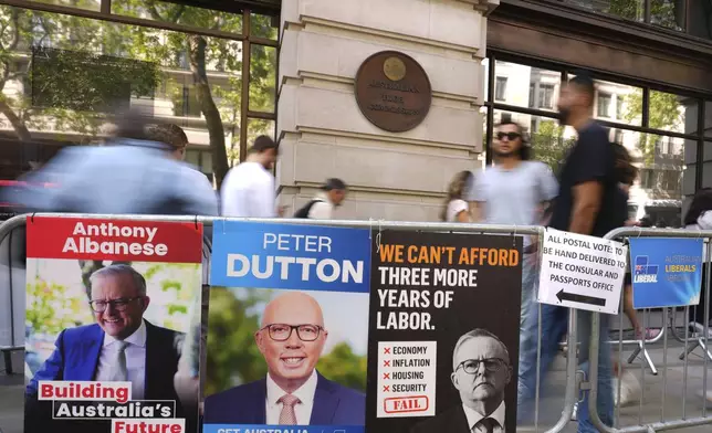People queue outside the Australian High Commission in London to vote in the Australian federal election, Friday, May 2, 2025. (AP Photo/Kirsty Wigglesworth)