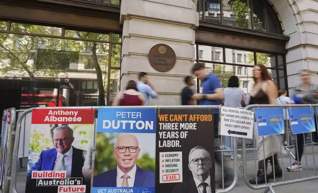 People queue outside the Australian High Commission in London to vote in the Australian federal election, Friday, May 2, 2025. (AP Photo/Kirsty Wigglesworth)