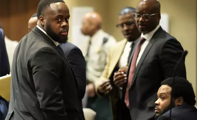 Former Memphis Police Officers Tedarrius Bean, left, and Demetrius Haley, right, two of three former Memphis officers charged with fatally beating Tyre Nichols in 2023, wait in the courtroom during a recess of their trial, Wednesday, April 30, 2025, in Memphis, Tenn. (AP Photo/George Walker IV, Pool)