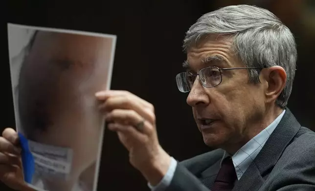 Forensic medical examiner Dr. Marco Ross presents photographic evidence before the jury during the trial of three former Memphis police officers accused in the 2023 fatal beating of Tyre Nichols, Wednesday, April 30, 2025, in Memphis, Tenn. (AP Photo/George Walker IV, Pool)
