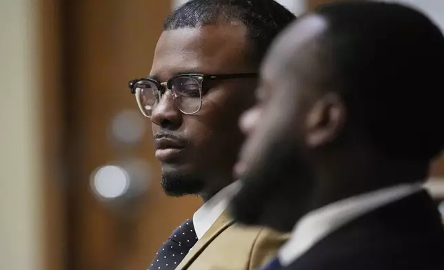 Former Memphis Police Officer Justin Smith Jr., left, sits in the courtroom Wednesday, April 30, 2025, during the state trial of Smith and two other former police officers accused in the 2023 death of Tyre Nichols, in Memphis, Tenn. (AP Photo/George Walker IV, Pool)