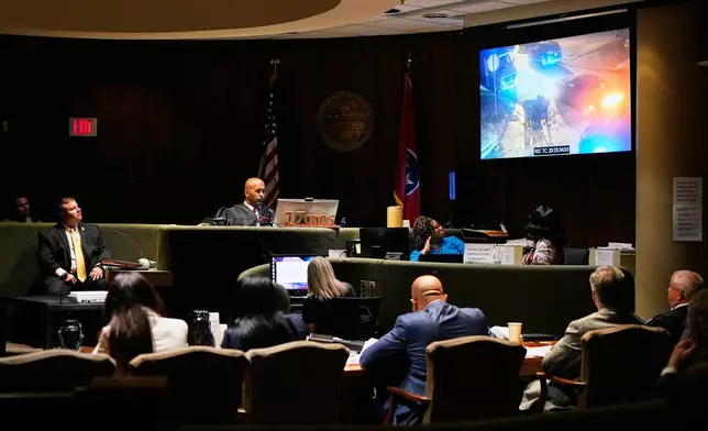 Tennessee Bureau of Investigations Special Agent Derek Miller, left, watches video evidence with members of the court during the trial of three former Memphis police officers accused in the 2023 death of Tyre Nichols, in Memphis, Tenn. Wednesday, April 30, 2025. (AP Photo/George Walker IV, Pool)