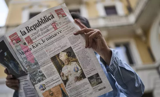 The intelligence-generated image of President Donald Trump dressed as pope fills the front-page of an Italian newspaper in Rome, Sunday, May 4, 2025. (AP Photo/Bernat Armangue)