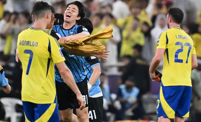 Kawasaki Frontale players, center, celebrate after defeating Al Nassr in a AFC Champions League Elite semifinal soccer match at Alinma Stadium in Jeddah, Saudi Arabia, Wednesday, April 30, 2025. (AP Photo/Ali Issa)
