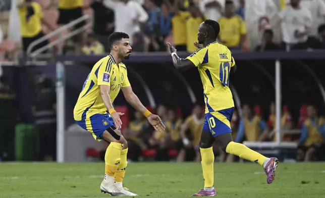Al Nassr's Sadio Mane, right, celebrates after scoring against Japan's Kawasaki Frontale, during a AFC Champions League Elite semifinal soccer match at Alinma Stadium in Jeddah, Saudi Arabia, Wednesday, April 30, 2025. (AP Photo/Ali Issa)