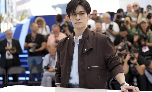 Jackson Yee poses for photographers at the photo call for the film "Resurrection" at the 78th international film festival in Cannes, southern France, Friday, May 23, 2025. (AP Photo/Natacha Pisarenko)