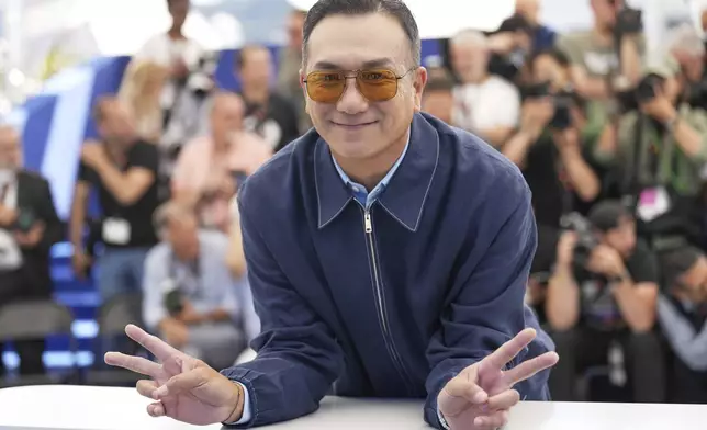Huang Jue poses for photographers at the photo call for the film "Resurrection" at the 78th international film festival in Cannes, southern France, Friday, May 23, 2025. (AP Photo/Natacha Pisarenko)