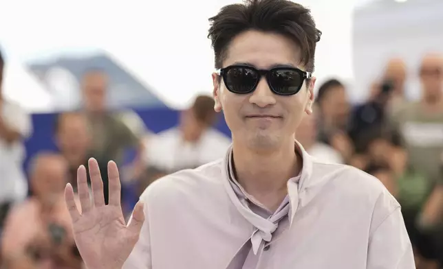 Mark Chao poses for photographers at the photo call for the film "Resurrection" at the 78th international film festival in Cannes, southern France, Friday, May 23, 2025. (AP Photo/Natacha Pisarenko)