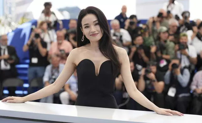 Shu Qi poses for photographers at the photo call for the film "Resurrection" during the 78th international film festival in Cannes, southern France, Friday, May 23, 2025. (AP Photo/Natacha Pisarenko)
