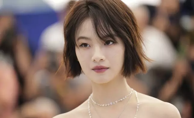 Gengxi Li poses for photographers at the photo call for the film "Resurrection" during the 78th international film festival in Cannes, southern France, Friday, May 23, 2025. (AP Photo/Natacha Pisarenko)