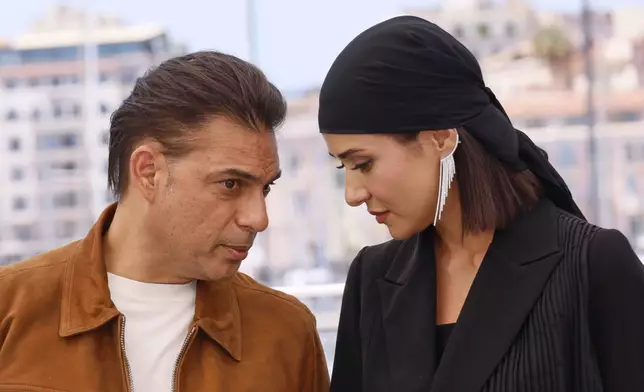 Payman Maadi, left, and Parinaz Izadyar pose for photographers at the photo call for the film 'Woman and Child' at the 78th international film festival, Cannes, southern France, Friday, May 23, 2025. (Photo by Joel C Ryan/Invision/AP)