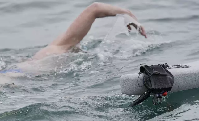 An instrument that sends an electronic signal into the water to ward off sharks is attached to a kayak near endurance swimmer Louis Pugh, Thursday, May 15, 2025, off Edgartown, Mass. (AP Photo/Robert F. Bukaty)