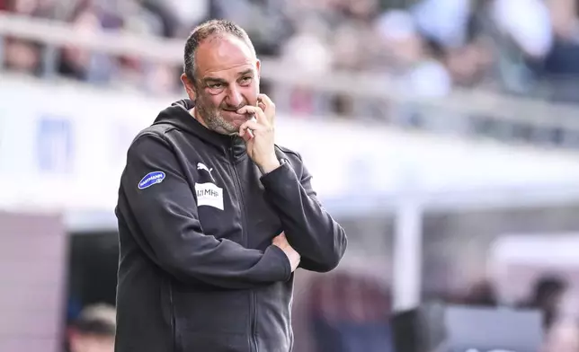 Heidenheim coach Frank Schmidt watches the game during the German Bundesliga soccer match between 1. FC Heidenheim and Werder Bremen at Voith-Arena in Heidenheim, Germany, Saturday May 17, 2025. (Harry Langer/dpa via AP)