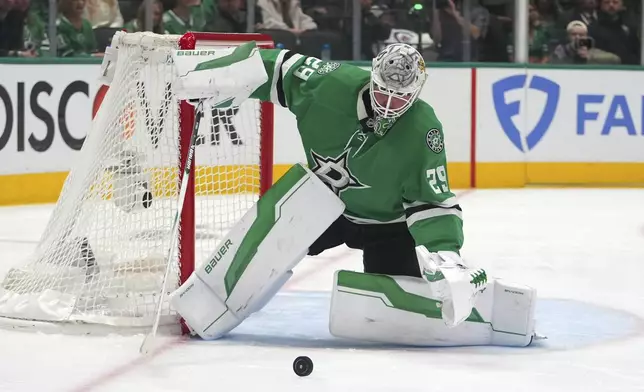 Dallas Stars' Jake Oettinger defends against a shot from the Winnipeg Jets in the second period of Game 3 of a second-round NHL hockey playoff series in Dallas, Sunday, May 11, 2025. (AP Photo/Julio Cortez)