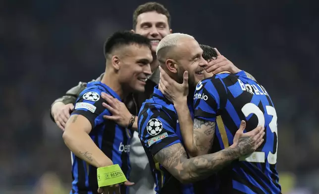 Inter Milan players celebrate at the end of the Champions League semifinal second leg soccer match between Inter Milan and Barcelona at San Siro stadium in Milan , Italy, Tuesday, May 6, 2025. (AP Photo/Luca Bruno)