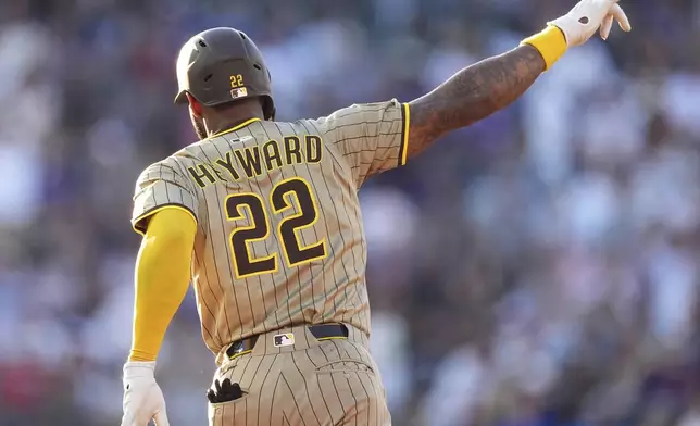 San Diego Padres' Jason Heyward gestures to the bullpen as he circles the bases after hitting a two-run home run off Colorado Rockies starting pitcher Bradley Blalock in the fourth inning of a baseball game Saturday, May 10, 2025, in Denver. (AP Photo/David Zalubowski)