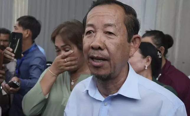 Cambodian prominent opposition politician Rong Chhun talks to media near the Phnom Penh Municipal Court in Phnom Penh, Cambodia, Monday, May 5, 2025. (AP Photo/Heng Sinith)