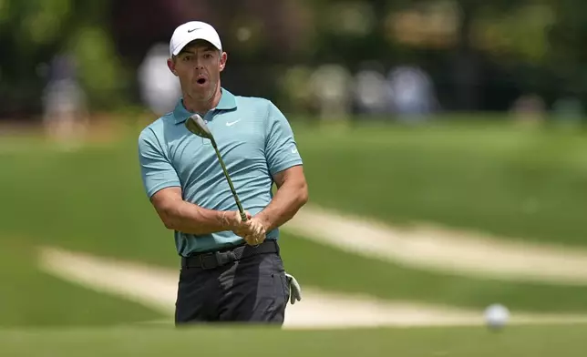 Rory McIlroy, of Northern Ireland, chips to the green on the 11th hole during a practice round for the PGA Championship golf tournament at the Quail Hollow Club, Wednesday, May 14, 2025, in Charlotte, N.C. (AP Photo/David J. Phillip)