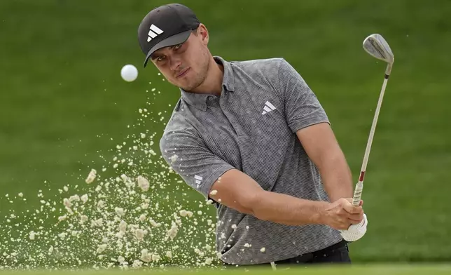 Ludvig Åberg, of Sweden, hits from the bunker on the first hole during a practice round for the PGA Championship golf tournament at the Quail Hollow Club, Wednesday, May 14, 2025, in Charlotte, N.C. (AP Photo/David J. Phillip)