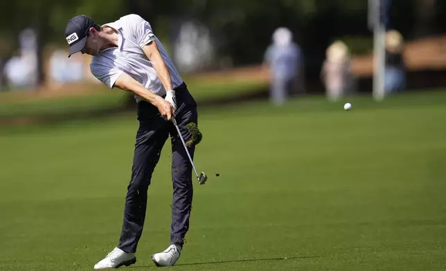 Alex Smalley hits from the fairway on the second hole during the first round of the PGA Championship golf tournament at the Quail Hollow Club, Thursday, May 15, 2025, in Charlotte, N.C. (AP Photo/George Walker IV)