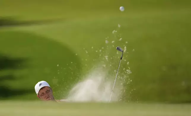 Cameron Davis, of Australia, hits from the bunker on the eighth hole during the first round of the PGA Championship golf tournament at the Quail Hollow Club, Thursday, May 15, 2025, in Charlotte, N.C. (AP Photo/Matt York)