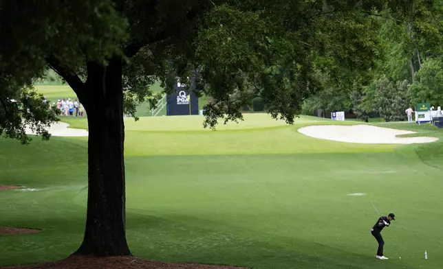 Justin Rose, of England, hits from the fairway on the 12th hole during a practice round for the PGA Championship golf tournament at the Quail Hollow Club, Tuesday, May 13, 2025, in Charlotte, N.C. (AP Photo/David J. Phillip)