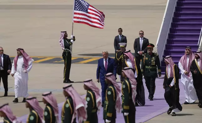 President Donald Trump speaks with Saudi Crown Prince Mohammed bin Salman during an arrival ceremony at the Royal Terminal of King Khalid International Airport in Riyadh, Saudi Arabia, Tuesday, May 13, 2025. (AP Photo/Alex Brandon)