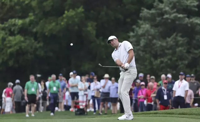 Scottie Scheffler chips off the fifth fairway during the first round of the CJ Cup Byron Nelson golf tournament in McKinney, Texas, Thursday, May 1, 2025. (AP Photo/Gareth Patterson)