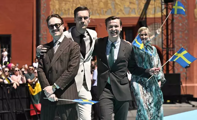 Sweden's KAJ pose for a photo, during the opening ceremony of the 69th Eurovision Song Contest, in Basel, Switzerland, Sunday, May 11, 2025. (Peter Schneider/Keystone via AP)