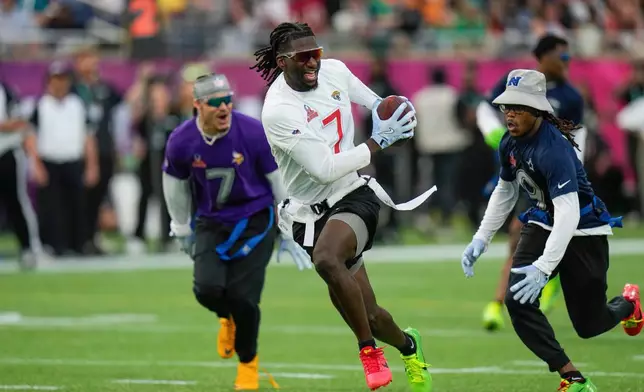 FILE - AFC wide receiver Brian Thomas Jr. (7), of the Jacksonville Jaguars, runs away from NFC return specialist KaVontae Turpin, of the Dallas Cowboys, right, during the flag football event at the NFL Pro Bowl, Sunday, Feb. 2, 2025, in Orlando. (AP Photo/Chris O'Meara, File)