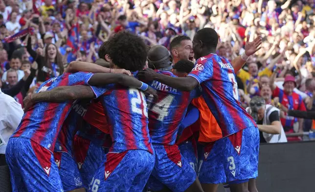 Crystal Palace players celebrate a goal that was later disallowed by a VAR decision during the English FA Cup final soccer match between Crystal Palace and Manchester City at Wembley stadium in London, Saturday, May 17, 2025. (AP Photo/Kirsty Wigglesworth)