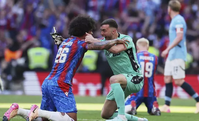 CORRECTS ID TO BACKUP GOALKEEPER MATT TURNER, NOT DEAN HENDERSON - Crystal Palace's Chris Richards and backup goalkeeper Matt Turner celebrate after winning the FA Cup final between Manchester City and Crystal Palace at the Wembley Stadium in London, Saturday, May 17, 2025. (AP Photo/Ian Walton)