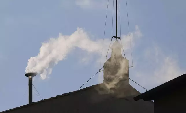 White smoke billows from the chimney of the Sistine Chapel where 133 cardinals are gathering on the second day of the conclave to elect a successor to late Pope Francis, at the Vatican, Thursday, May 8, 2025 (AP Photo/Alessandra Tarantino)