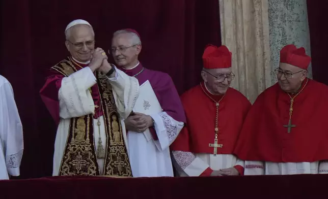 Pope Leo XIV appears on the balcony of St Peter's Basilica after his election, at the Vatican, Thursday, May 8, 2025. (AP Photo/Luca Bruno)