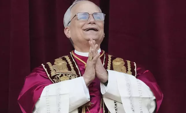 Newly elected Pope Leo XIV appears at the balcony of St. Peter's Basilica at the Vatican, Thursday, May 8, 2025. (AP Photo/Alessandra Tarantino)
