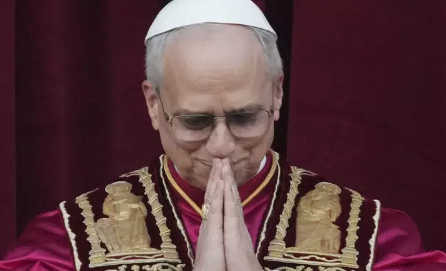 Newly elected Pope Leo XIV appears at the balcony of St. Peter's Basilica at the Vatican, Thursday, May 8, 2025. (AP Photo/Alessandra Tarantino)