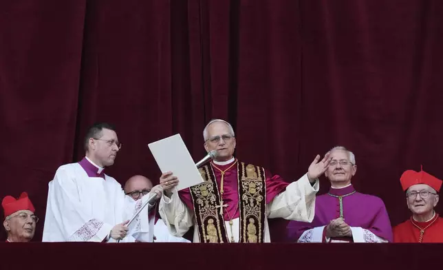 Newly elected Pope Leo XIV addresses the faithful from the balcony of St. Peter's Basilica at the Vatican, Thursday, May 8, 2025. (AP Photo/Alessandra Tarantino)