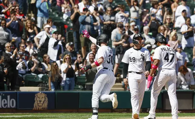 Chicago White Sox's Tim Elko (30) celebrates after hitting a three-run home run against the Miami Marlins during the sixth inning of a baseball game Sunday, May 11, 2025, in Chicago. (AP Photo/Kamil Krzaczynski)
