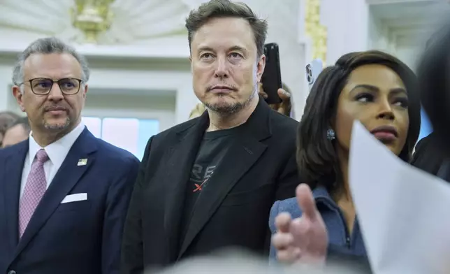 Elon Musk looks on as President Donald Trump meets South African President Cyril Ramaphosa in the Oval Office of the White House, Wednesday, May 21, 2025, in Washington. (AP Photo/Evan Vucci)