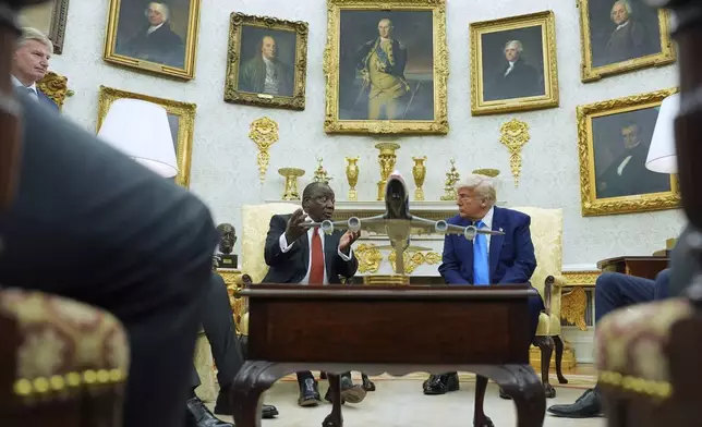 President Donald Trump meets South African President Cyril Ramaphosa in the Oval Office of the White House, Wednesday, May 21, 2025, in Washington. (AP Photo/Evan Vucci)
