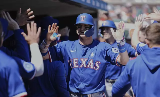 Texas Rangers' Josh Jung celebrates his two-run home run against the Detroit Tigers in the fifth inning during a baseball game, Sunday, May 11, 2025, in Detroit. (AP Photo/Paul Sancya)