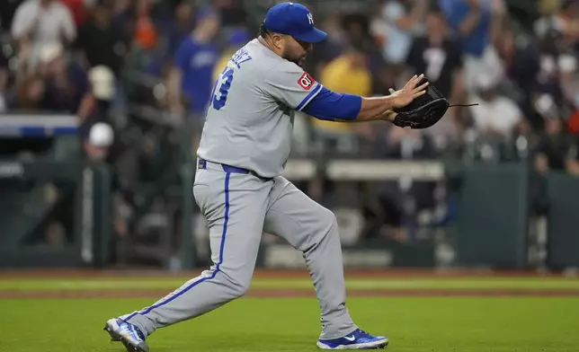 Kansas City Royals relief pitcher Carlos Estevez celebrates after winning a baseball game against the Houston Astros in Houston, Monday, May 12, 2025. (AP Photo/Ashley Landis)