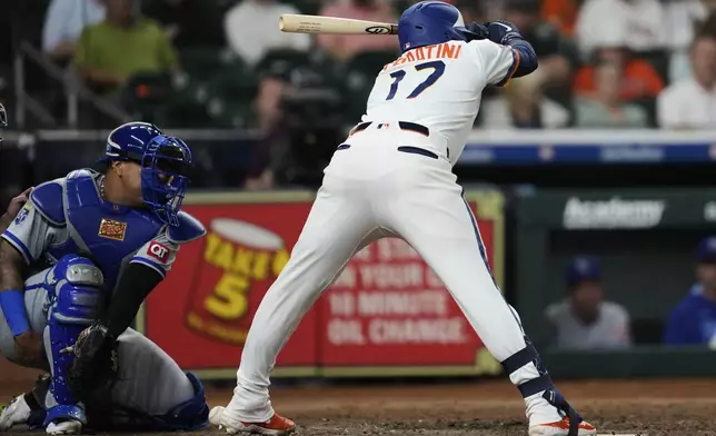 Houston Astros designated hitter Victor Caratini (17) is hit by a pitch from Kansas City Royals relief pitcher Steven Cruz during the eighth inning of a baseball game in Houston, Monday, May 12, 2025. (AP Photo/Ashley Landis)